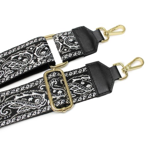 Pink bag strap with leather adjustments.